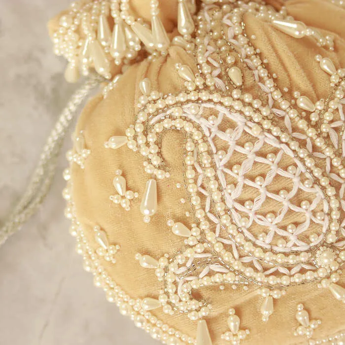 Sukoon Hand Embroidered Potli with Pearl Handle