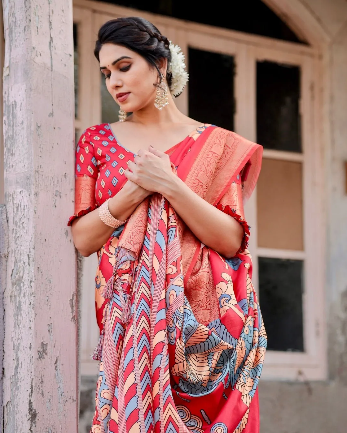 Vibrant Red Tussar Silk Saree with Bold Floral Motifs and Chevron Patterned Pallu