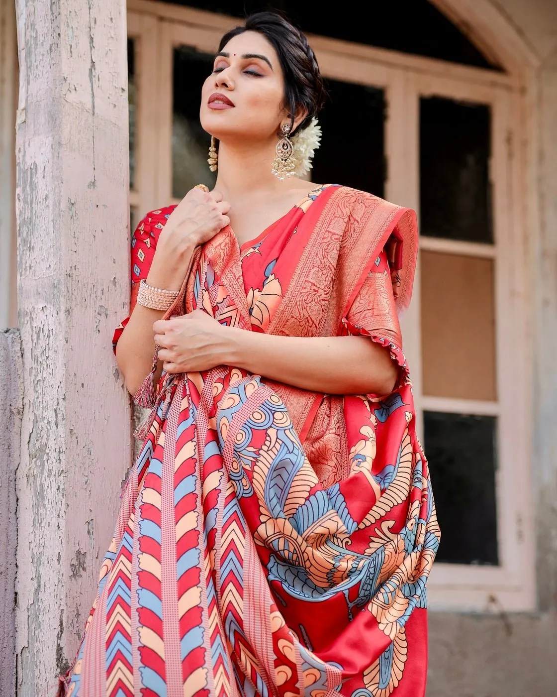 Vibrant Red Tussar Silk Saree with Bold Floral Motifs and Chevron Patterned Pallu